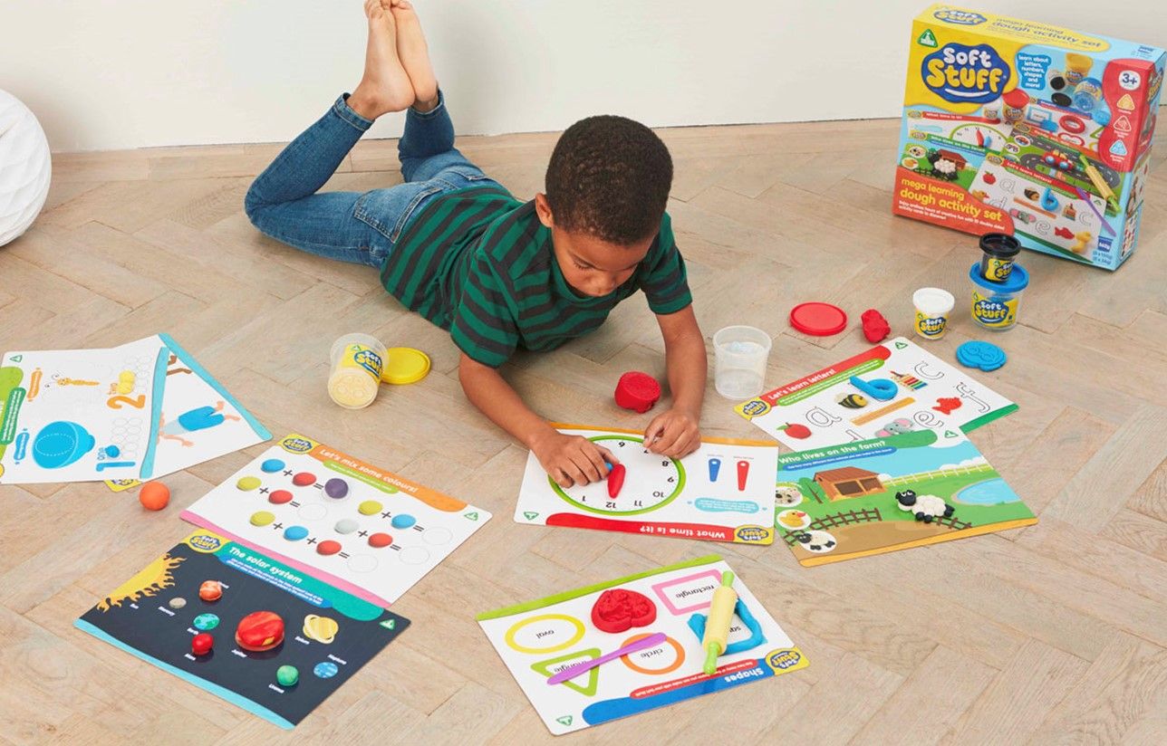 Child plays with dough set.