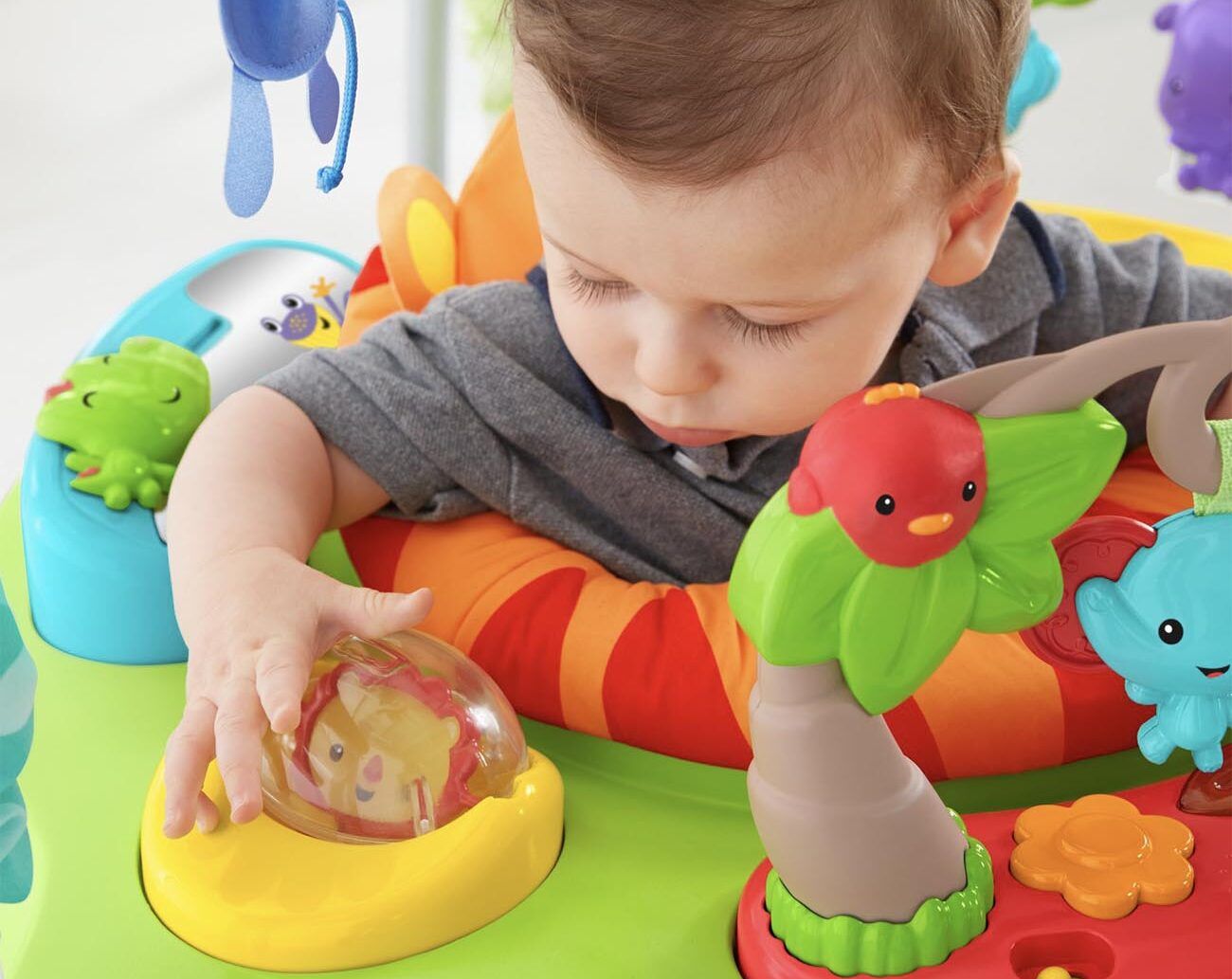 Baby plays in a baby walker.