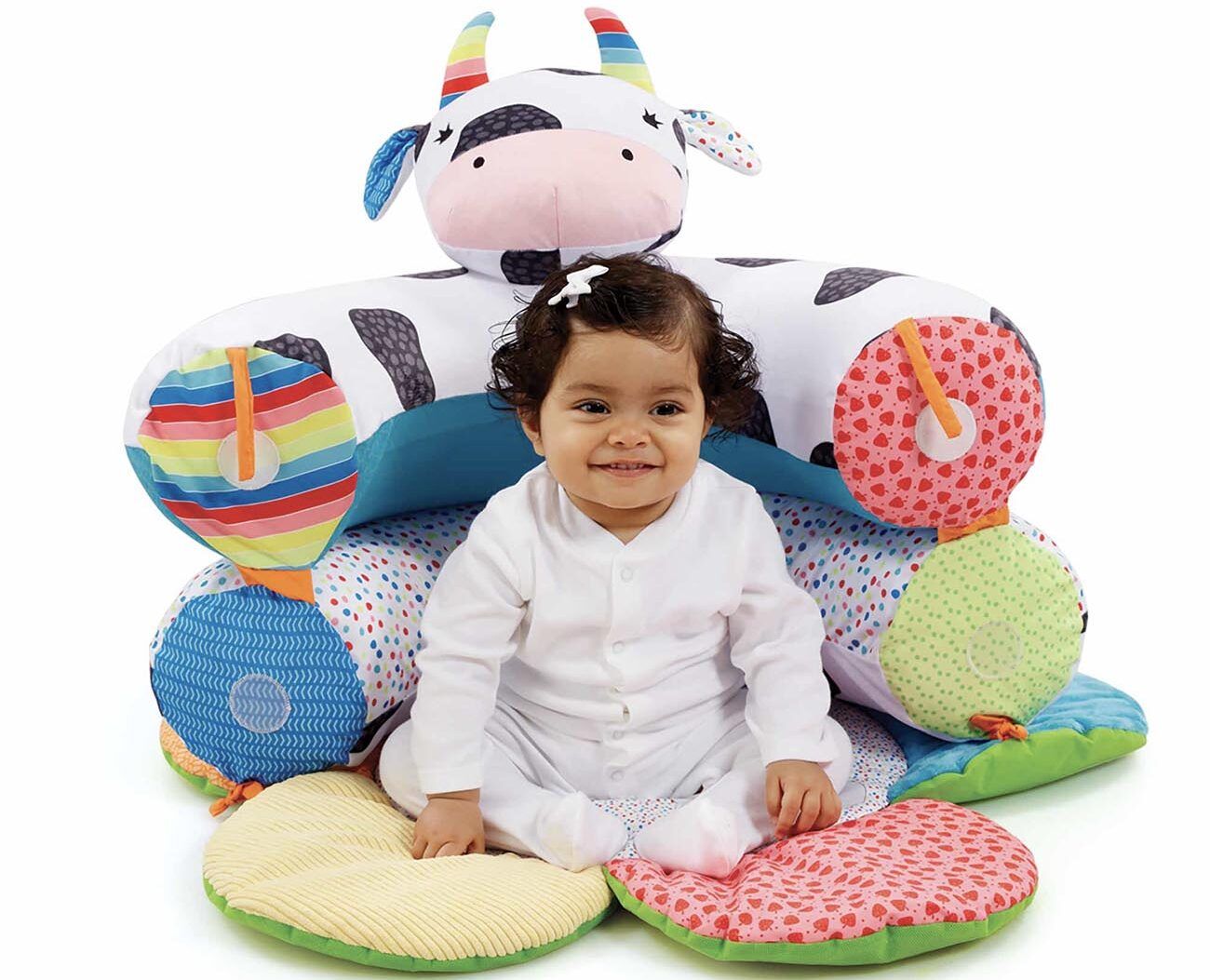 Child sits in a plush cushion.