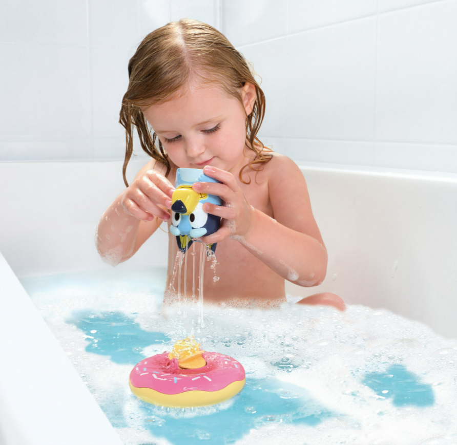 Child playing with bath toy.