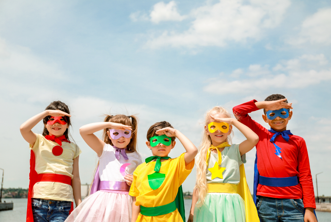 Group of children dressed as superheroes